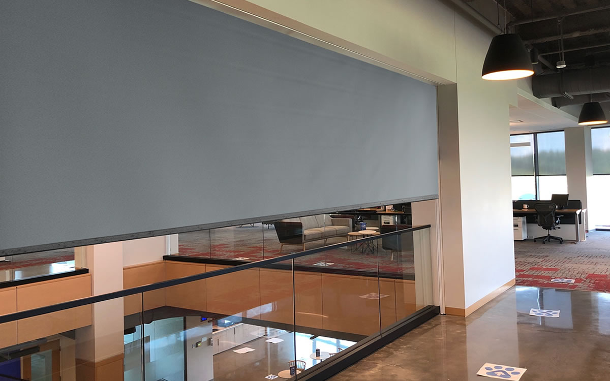 Fire protective curtain lowered across an opening