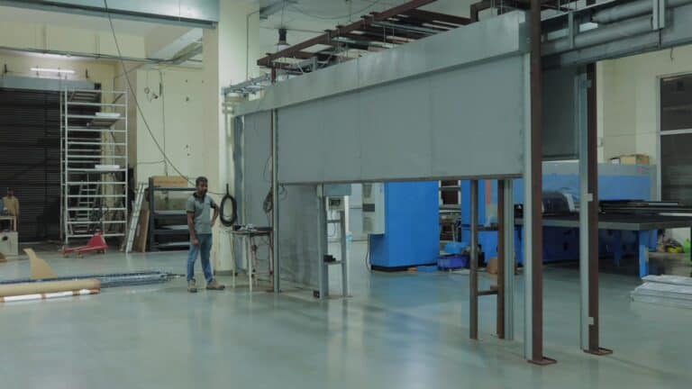 Fire curtain head box and guide rails on a trial frame in the factory